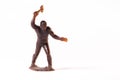 Large toy figures of primitive people on a white background Royalty Free Stock Photo