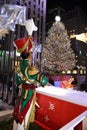 A Large toy nutcracker drummer statue and the holiday lights in Rockefeller Center
