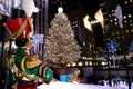 A Large toy nutcracker drummer statue and the holiday lights in Rockefeller Center