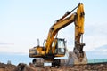 Large tracked excavator on a construction site. Royalty Free Stock Photo