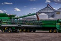 a large tractor trailer hauling a grain mill grain on its back