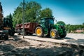Large tractor with a trailer, work on the road Royalty Free Stock Photo