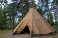 A large traditional teepee tent with luxurious glamping interior provides alternate but comfortable lodging for outdoor adventurer