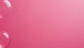 Large transparent bubbles gently floating on a soft pink gradient background Royalty Free Stock Photo