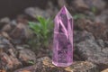 Large transparent mystical faceted crystal of colored pink amethyst, chalcedony on a stone background close-up. Wonderful mineral Royalty Free Stock Photo