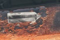 Large transparent mystical faceted crystal of white quartz on a rails on industrial background close-up. A wonderful mineral