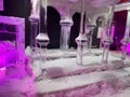 Large transparent winter ice sculptures and figures, columns at the festival
