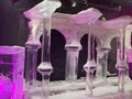Large transparent winter ice sculptures and figures, columns at the festival