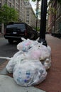 Large trash bags on the sidewalks and streets of Washington DC after an event