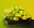 A large tray of carambola, also known as star fruit