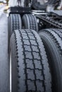 Large tread on big rig semi truck tractor tires wheels ensures safe grip when transporting heavy cargo Royalty Free Stock Photo