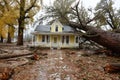 Hurricane causes tree to fall on house resulting in severe damage and destruction Royalty Free Stock Photo