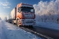 A large truck driving down a snow covered road during the winter. Sunset Royalty Free Stock Photo