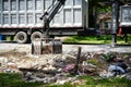 Large truck picking up trash and debris outside of Houston neighborhood Royalty Free Stock Photo