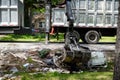 Large truck picking up trash and debris outside of Houston neighborhood Royalty Free Stock Photo