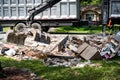 Large truck picking up trash and debris outside of Houston neighborhood