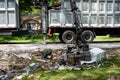 Large truck picking up trash and debris outside of Houston neighborhood Royalty Free Stock Photo