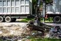 Large truck picking up trash and debris outside of Houston neighborhood Royalty Free Stock Photo