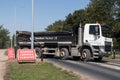 Large truck turning across road with Danger Lorries Turning sign Royalty Free Stock Photo