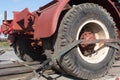 Large truck wheels secured with staps onto the back of a trailer for safe transport