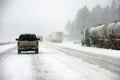 Large trucks fight a winter storm