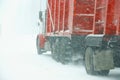 Large trucks fight a winter storm