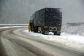 Large trucks fight a winter storm