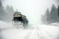 Large trucks fight a winter storm