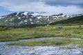 Turquoise River landscape and Arasluokta sami indigenous settlement