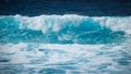 Large turquoise wave in the sea.