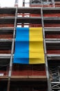 Large Ukrainian Flag on the Side of a Skyscraper Under Construction in Midtown Manhattan of New York City Royalty Free Stock Photo