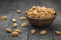 Large unpeeled almonds in a deep bowl on the table