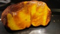 Large unprocessed piece of amber. Baltic amber, resin segments, background or texture.