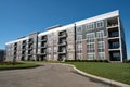 Large Utilitarian Style Gray Apartment Building