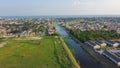 Large vacant land near Farrar Canal with residential houses, duplex townhomes, lush green trees in Little Woods neighborhood Royalty Free Stock Photo