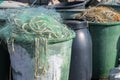 Large vats with plastic fishing nets on the quay in the harbor in Travemunde on the Baltic sea, copy space, selected focus