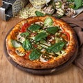 Large vegeterian pizza with sauces and pepper Royalty Free Stock Photo