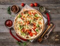 Large vegeterian pizza with sauces and pepper Royalty Free Stock Photo
