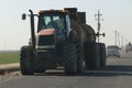 Large diesel tractors haul equipment on highway 140, northern California. Nov 2019.