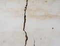 Large vertical crack in plastered wall Royalty Free Stock Photo