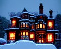 Large Victorian Mansion Covered in Snow at Night. Generative AI Royalty Free Stock Photo