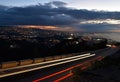 Large view of lebanese shore Beirut cityscape by night with the red track lights of car on a foreground, Beirut Lebanon at dusk