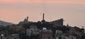 Large view of lebanese shore with maronite church of Harissa and Saint Paul Cathedral in Daaroun Leban with the red light of dusk