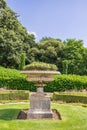 Edwardian stone tazza planter with growing flowers in a public park, UK. Royalty Free Stock Photo