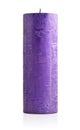 Large violet candle with a rough texture