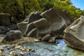 Large volcanic boulders impede the course of the Alcantara river near Taormina, Sicily