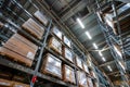 Large warehouse interior with rows of shelves and carts in IKEA