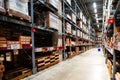 Large warehouse interior with rows of shelves and carts in IKEA