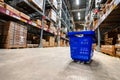 Large warehouse interior with rows of shelves and carts in IKEA