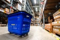 Large warehouse interior with rows of shelves and carts in IKEA